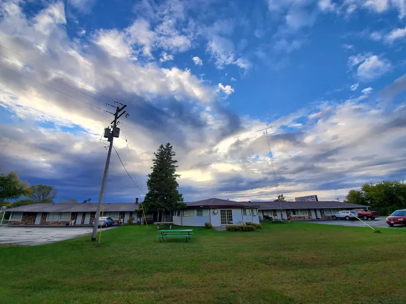 Dramatic evening clouds over the lawn and motel